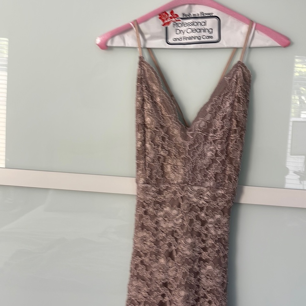 Lacy rose gold cocktail dress.